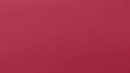 Hand Holds White Gift with Red Ribbon