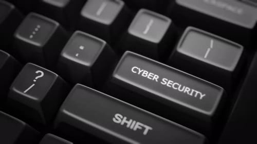 Cyber Security Text Glowing on Computer Keyboard Key