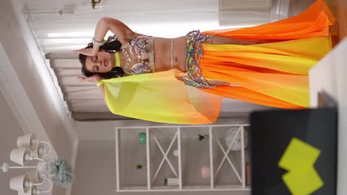 Woman Belly Dancing in Colorful Costume