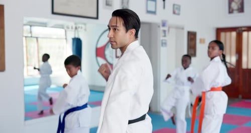 Karate Students Practice Punches in Studio
