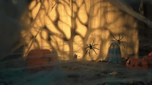 Spooky Halloween Scene with Pumpkins and Ghosts