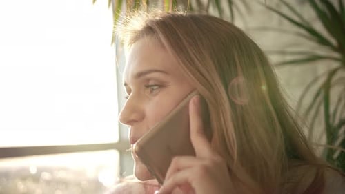 Woman Talking Mobile. Closeup View Of Speaking Woman Face With Telephone. Smiling Girl Speaking P...