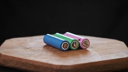 Colorful Batteries on a Wooden Surface