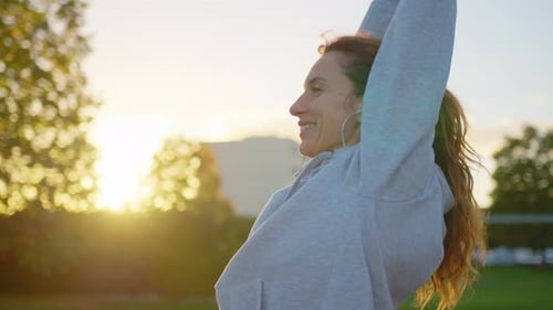 Close Up of Athletic Young Female Exercising Stretching and Doing Yoga
