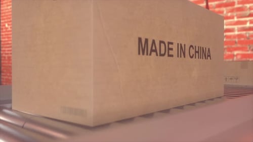Moving Cardboard Boxes with Made in China Label on Conveyor