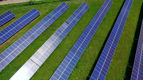 Solar panels at sunlight. Photovoltaic panels farm of green renewable energy on field.