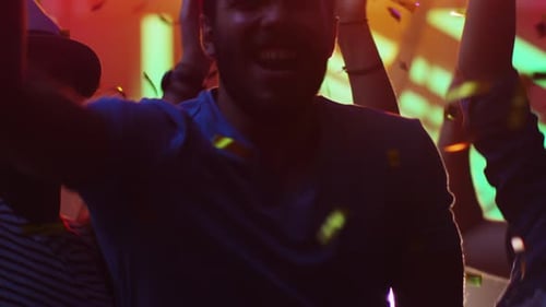 People Dancing, Having Fun and Raising Hands in Nightclub.