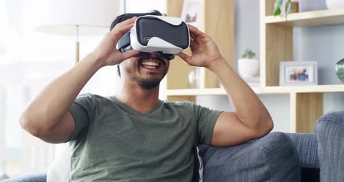 Man Enjoying Virtual Reality Headset Experience at Home