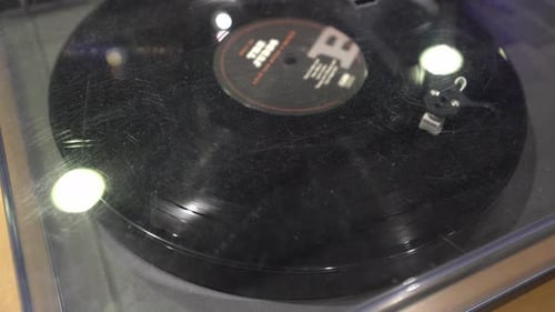 Vinyl Record Spinning on a Turntable in Close Up