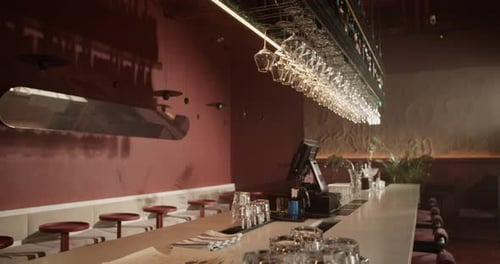 Wineglass Rack Above Counter with Computer in Bar