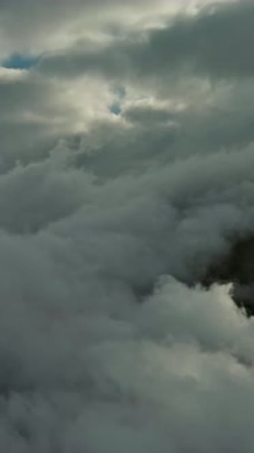 Aerial high view of dramatic clouds flying