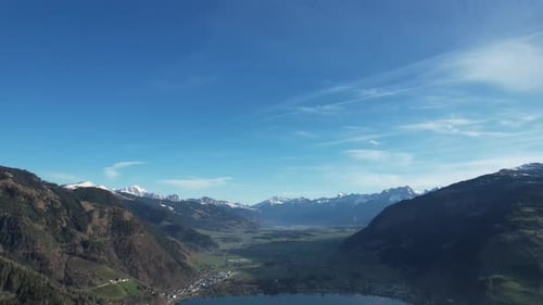 Aerial video of village, snowy mountains and lakes in Tyrol, Austrian Alps, Austria