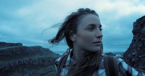 4k video footage of a young woman enjoying a hike on a mountain range outdoors