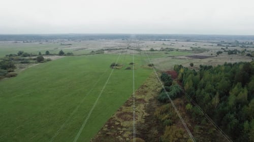 Flying Over a Power Line Electric Transmissions in Field Steel Towers with Wires and Communication