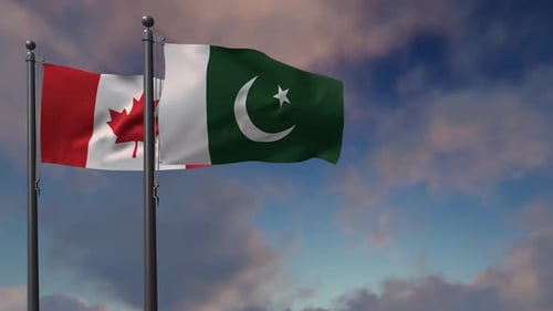 Canada and Pakistan Flags Waving Against a Cloudy Sky