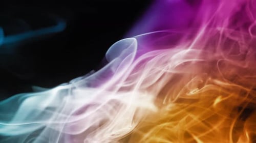Colorful Smoke Flowing on a Black Background