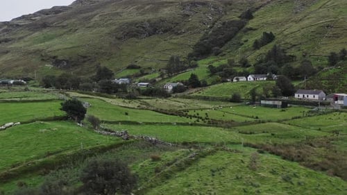 Witness the stunning greenery and serene beauty of County Donegal, Ireland, captured from above. Rol