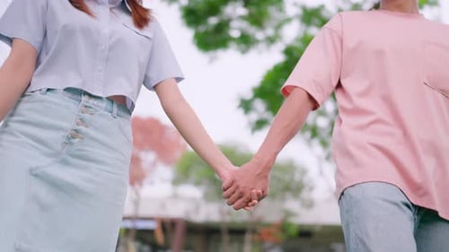 Close-up of a man looking back, trusting, holding hands, enjoying, relaxing, walking, forward into