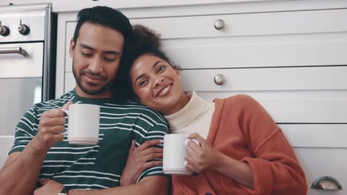 Loving Couple Relaxing with Coffee at Home
