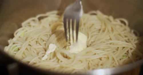 Spaghetti With Butter in Pot Close Up Shot