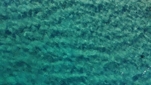 Calm Clear Sea Water Background. Calm Sea Water Background. Aerial footage of a perfectly crystal cl