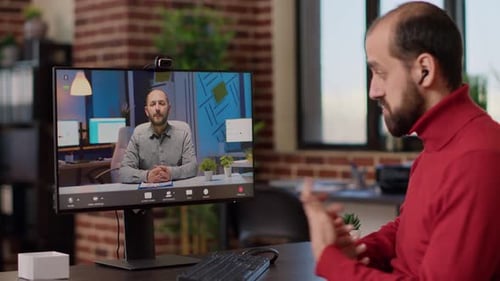 Two Men Connecting on a Video Conference Call