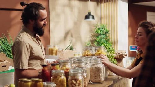Small Business Owner Serving Customer at Counter