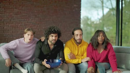 multicultural friends in exuberant celebration rejoicing and cheering for their beloved sports club