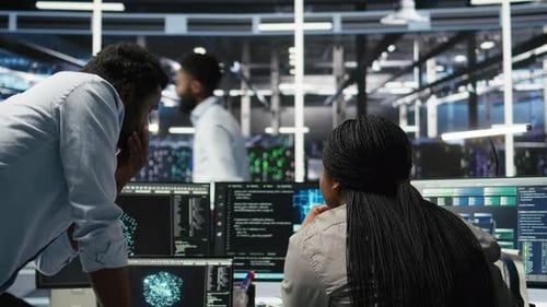 Data Center Manager Supervising Worker Deploying AI Solutions