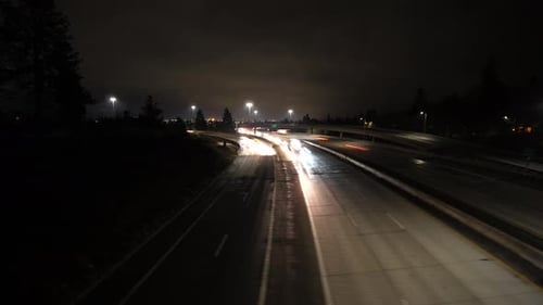 Moving hyperlapse of freeway at night with cars and traffic timelapse