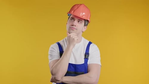 Man Wearing Construction Hat Thinking Hard