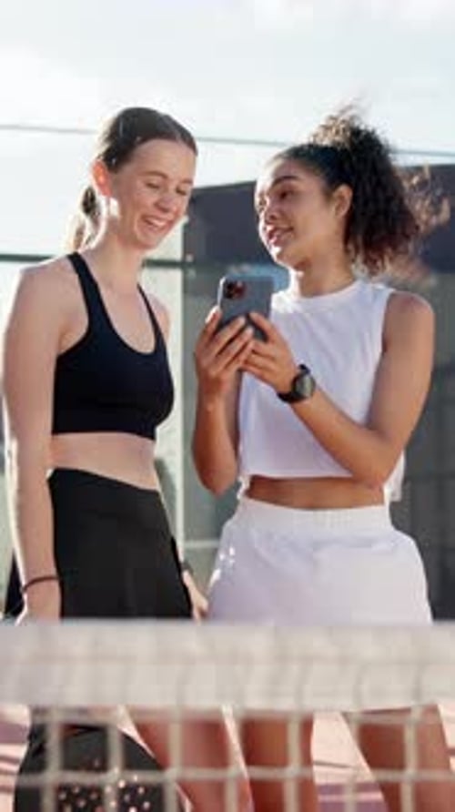 Girl, friends and phone with laughing at tennis court for meme, share or video with sports