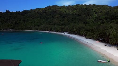 jetty pier at tropical beach, turquoise water. Marvelous aerial view flight drone