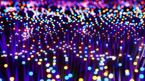 Abstract Glowing Optical Fibers and Particles Animation Loop