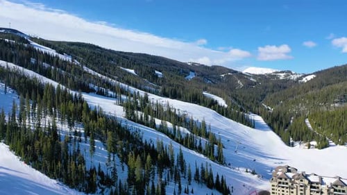 Chair Lifts and Downhill Skiers at Big Sky Resort – Winter Drone Flyover