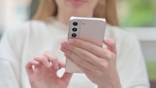 Close Up of Woman Using Smartphone Outdoor