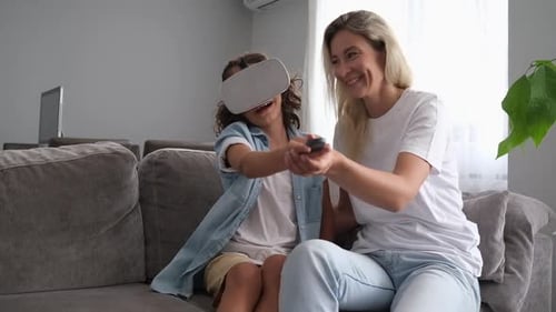Child and Woman Laughing While Using VR Headset