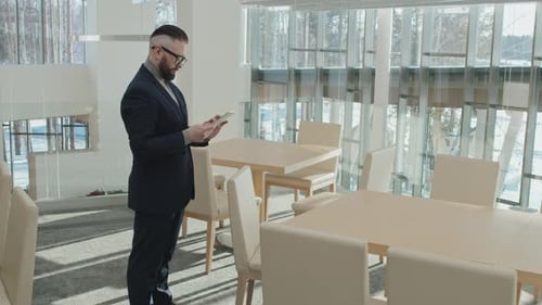 Businessman Using Digital Tablet for Online Work