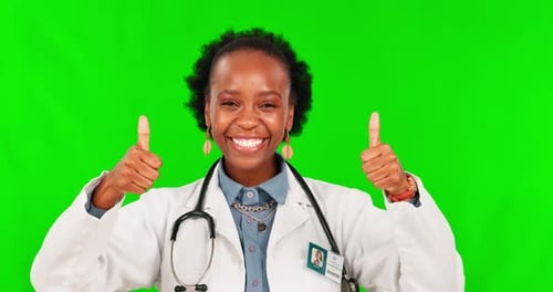 Doctor, thumbs up and black woman success on a green screen for support, thank you and medicine