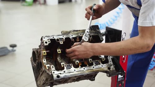 Auto Mechanic Disassembles Engine Block Extracts Crankshaft at Service Station Professional Uses