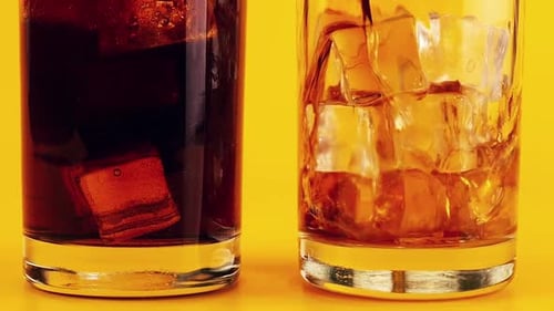 Cola Poured Into Glass With Ice Cubes