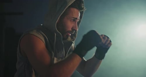 Boxer Training in Low Light Gym