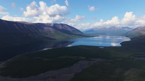 Aerial View of Lake Lama Basin with Ridge Shadow and Dramatic Cloud Reflection