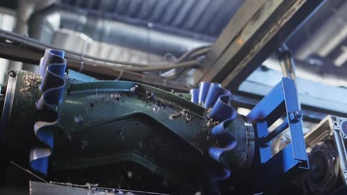 Used Tyres Small Pieces Fall Down From Conveyor in Workshop