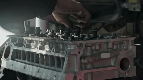 Manually Fastening Car Engine Cylinder Block Bolts In The Repair Shop