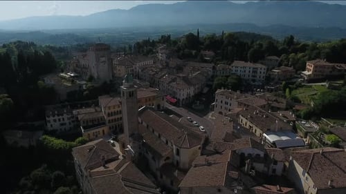 Aerial view of buildings and mountains, Italy.