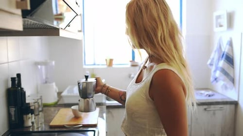 Woman Pours Espresso in Bright Kitchen