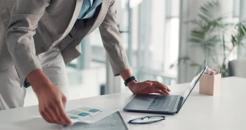 Man Works on Laptop in Modern Office