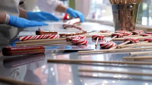 A Set of Caramel Candies on a Stick and Tools for Making Sweets in a Pastry Shop