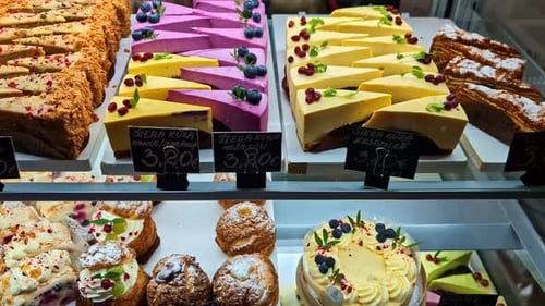 Colorful cake and pastry display in a cafe